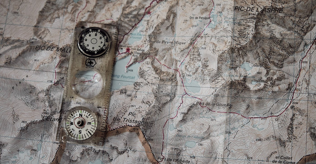 A compass and map showing the Pyrenees