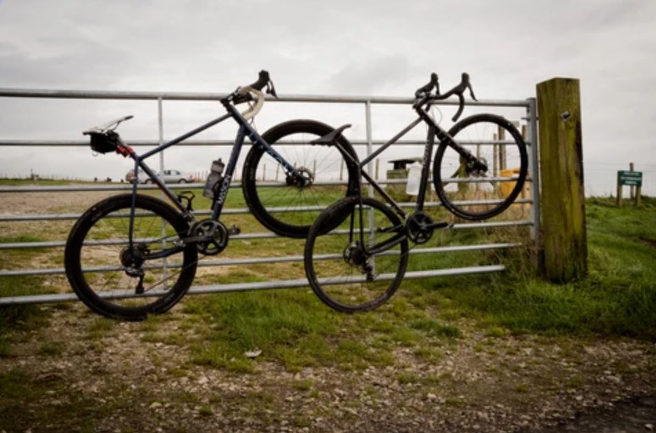 bikes hanging on a gate with Hunt disc wheels