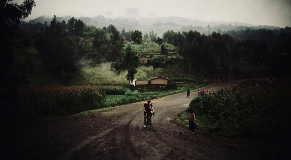 Josh climbing a foggy road in Rwanda