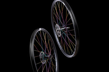 <h1>Oil-Slick Spokes</h1><i>We can also give the spokes a Ti-Nitride coating which not only gives them an eye-catching oil slick rainbow look but also improves wear and corrosion resistance due to the super-hard micro hardness of this coating. The coating is multi-compounded by ceramics and transition metal, so the bonding force between coating and base is immensely improved. This results in a really long lasting finish.</i>