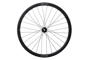 <h1>Rims</h1><i>A strong and super-lightweight rim featuring unidirectional T24/30 carbon fibre with 3K weave re-enforced spoke holes. The wide aero profile delivers excellent handling and speed. The evolution of disc brake specific construction has allowed massive weight savings over equivalent rim-brake rims. The removal of braking forces on the rim allows a strong but very light rim to be designed that can focus on it's primary roles of supporting the tire and spoke forces.</i>
